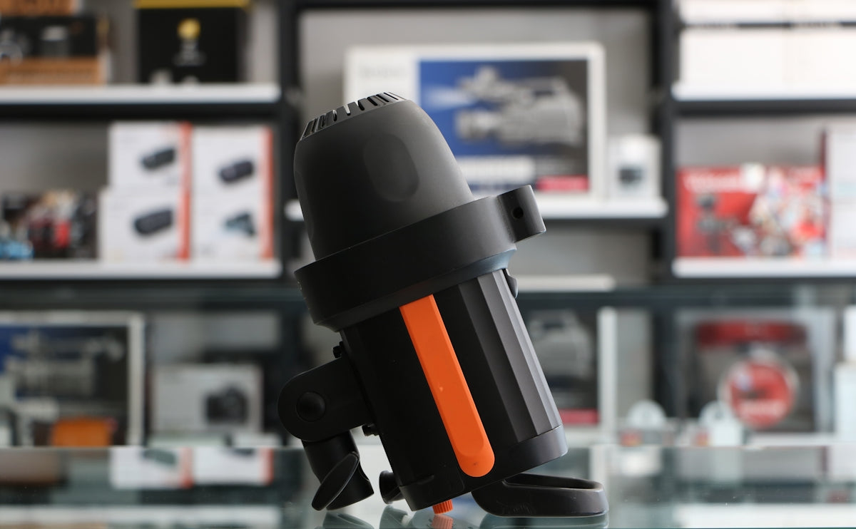 a black and orange object sitting on top of a glass table