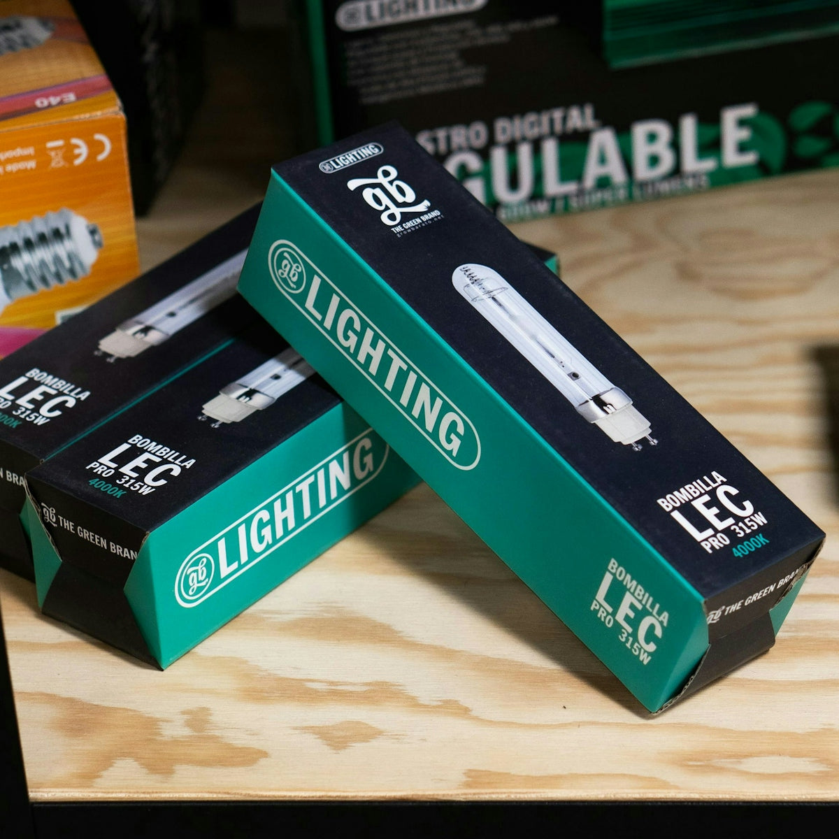 Three boxes of toothbrushes sitting on a table