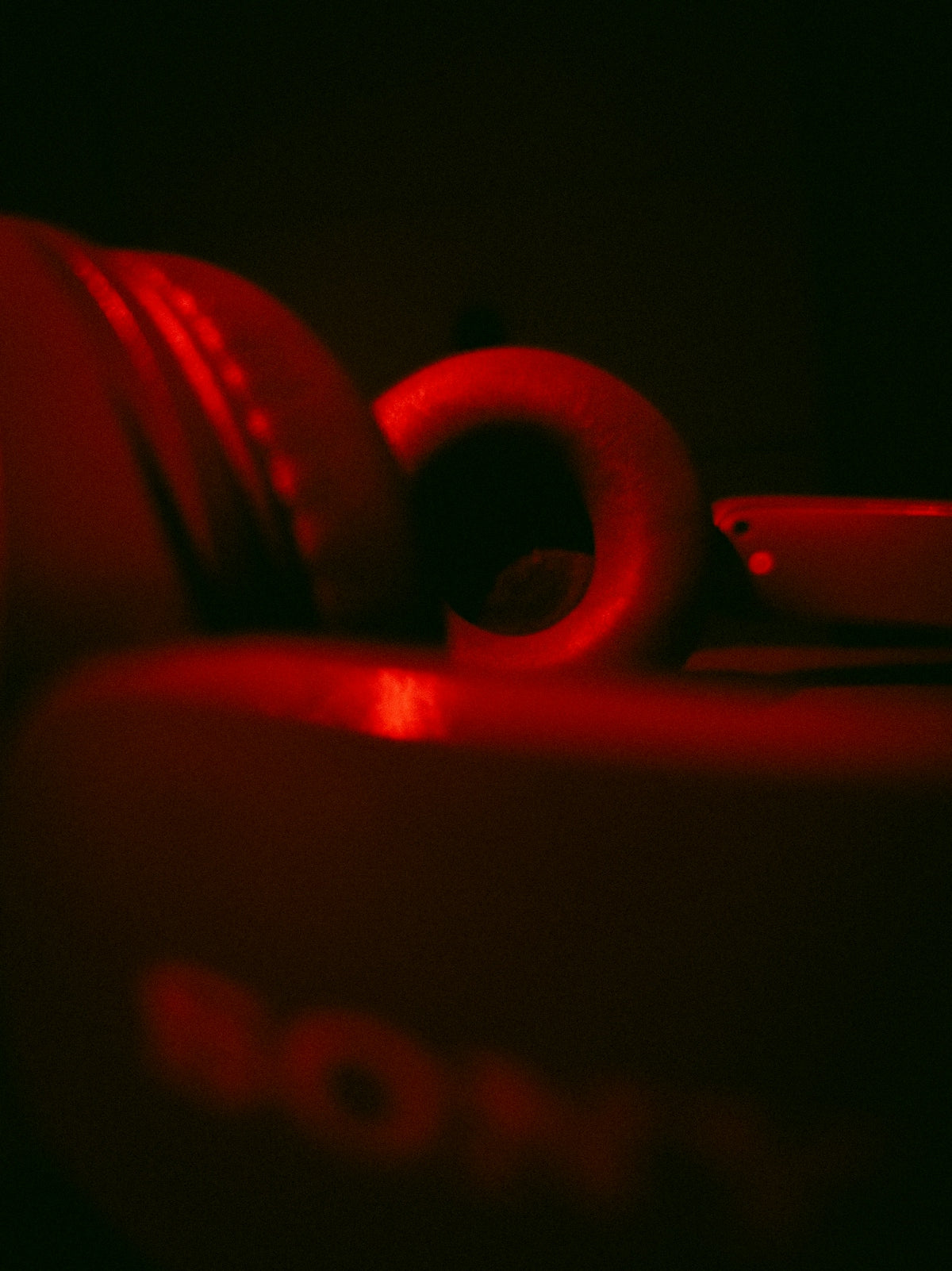 Red illuminated headphones with sony logo visible