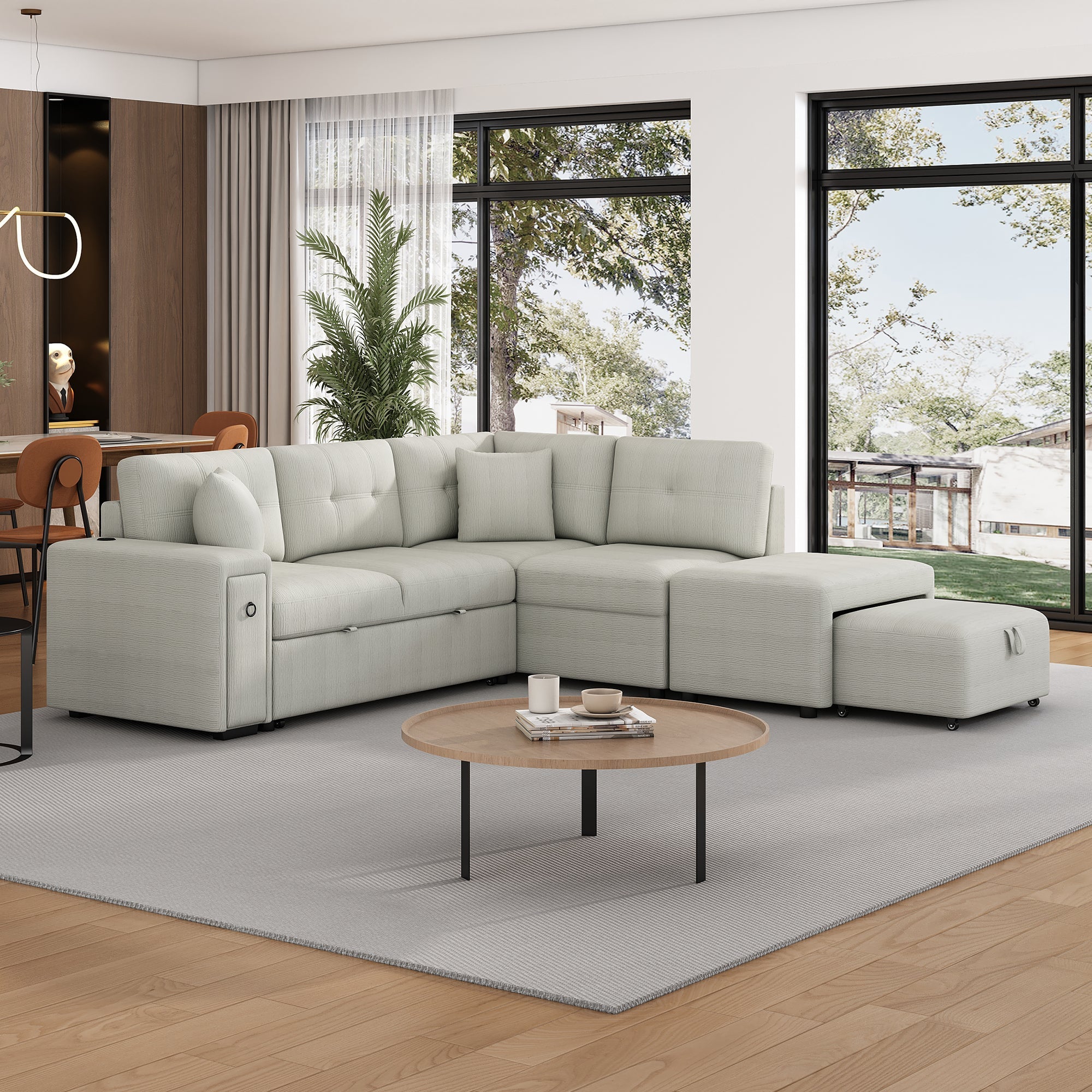 Gray chenille 4-seater convertible sofa bed with movable ottoman and drop-down table with cup holders.