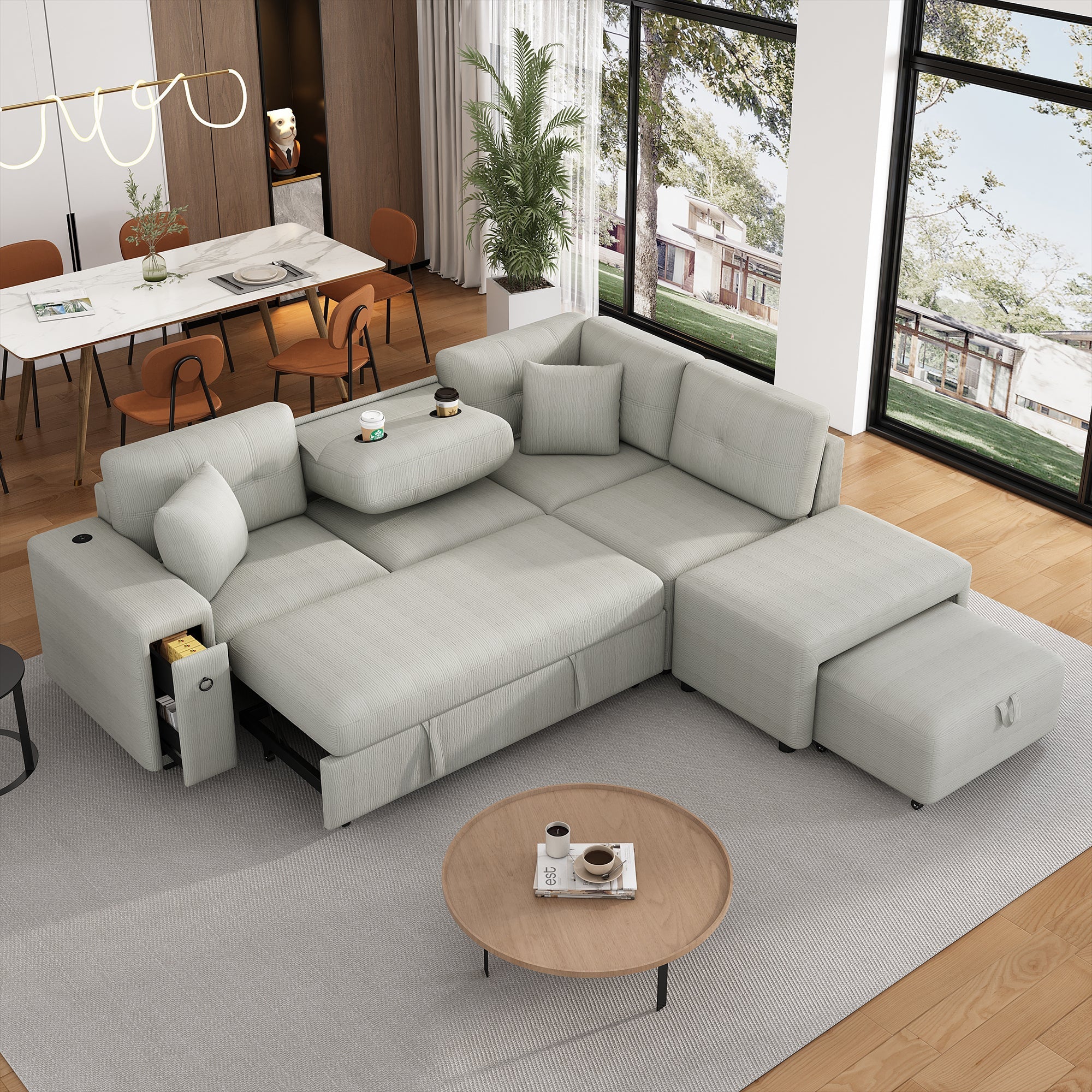 Gray chenille 4-seater convertible sofa bed with movable ottoman and drop-down table with cup holders.