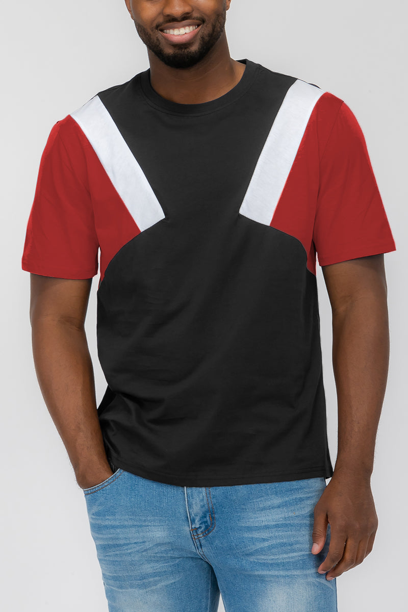 A red, white, and black ANGLED COLOR BLOCK TEE Front side of t shirt worn by a male model.