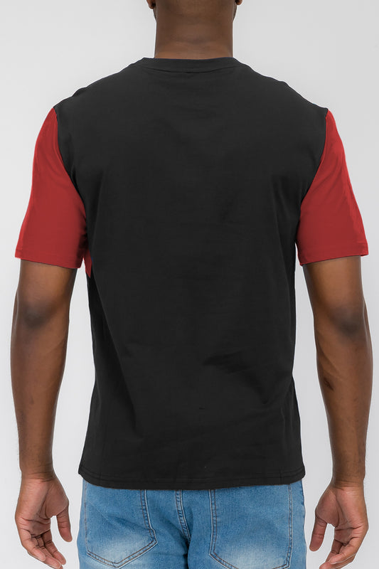 The back of an angled color block tee worn by a male model.