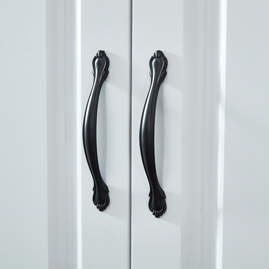 Close-up of Black Door Handles Detail on White Armoire Doors