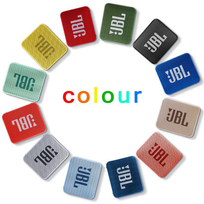 Colorful variety of JBL GO 2 speakers arranged in a circular pattern on a white background.