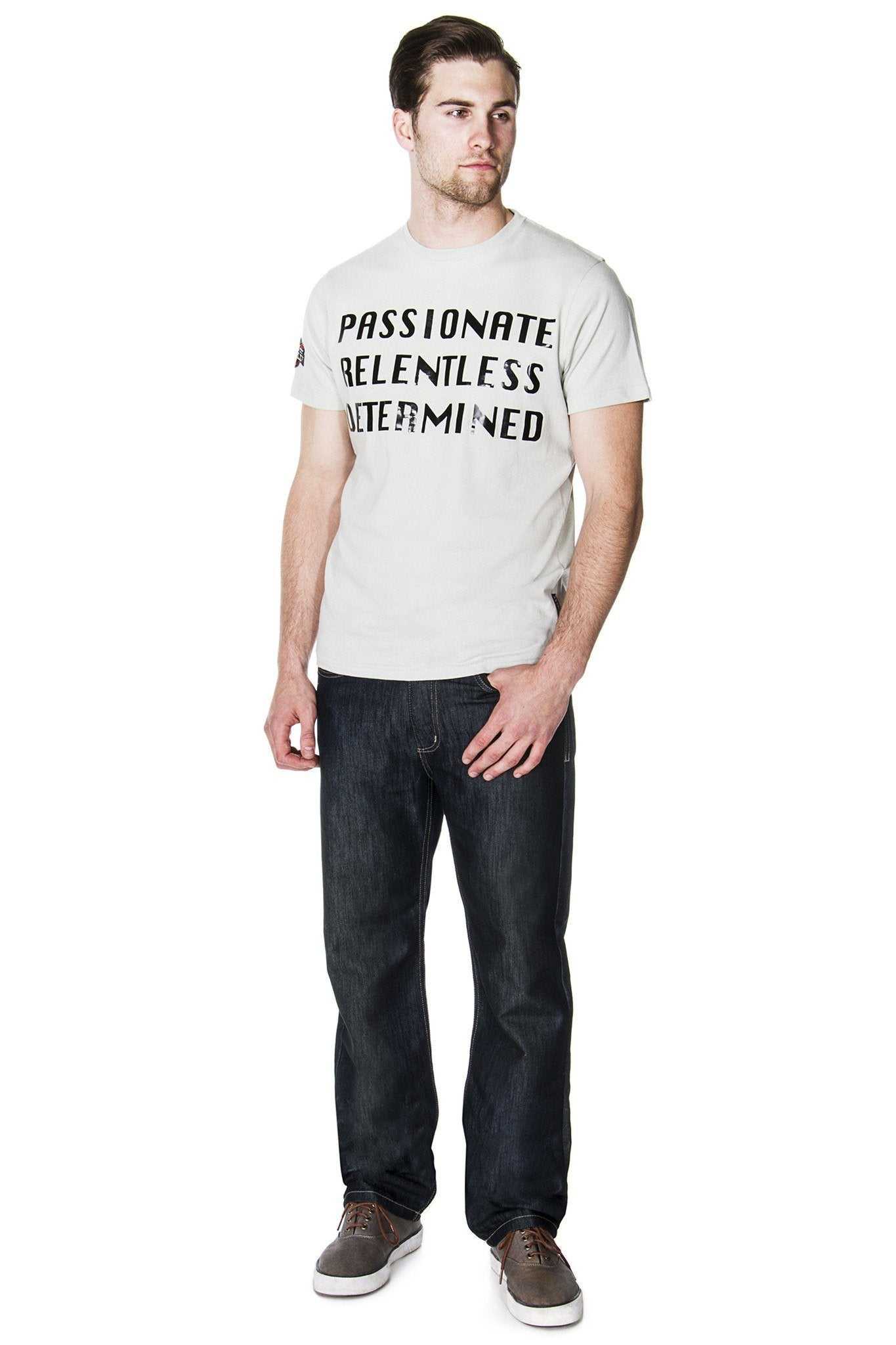 Full view of a man wearing the 65 MCMLXV dark wash straight-leg jeans in a contemporary look.