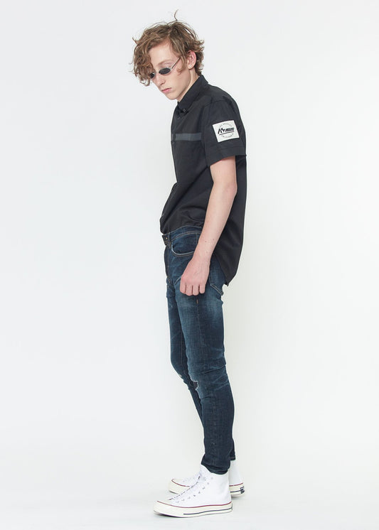 Side view of Konus skinny jeans, showing the slim profile and flexible fit (99% cotton, 1% spandex).