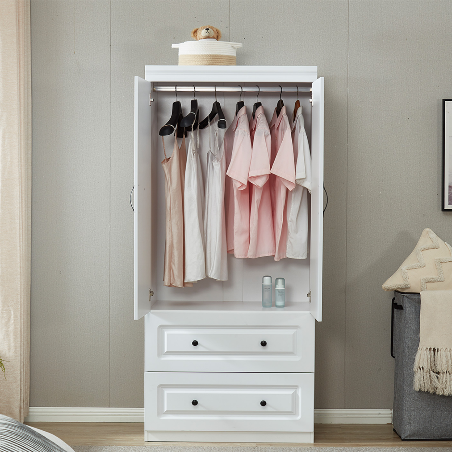 Interior View of White Armoire with Clothes Hanging Rod and 2 Storage Drawers.