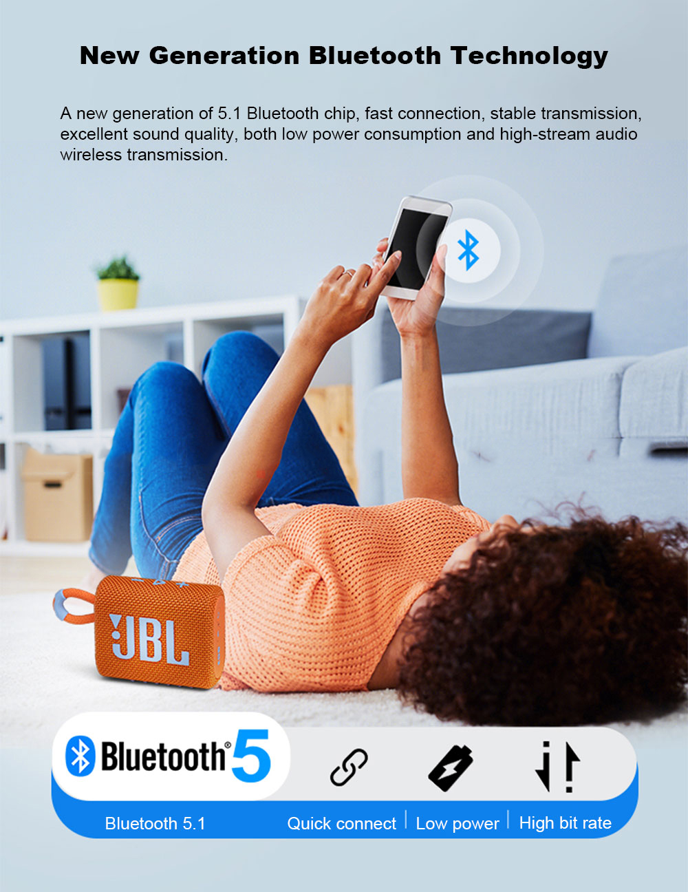 Lifestyle: Woman using the Orange JBL Go 3 speaker outdoors. Wireless Bluetooth streaming for personal, active lifestyle.